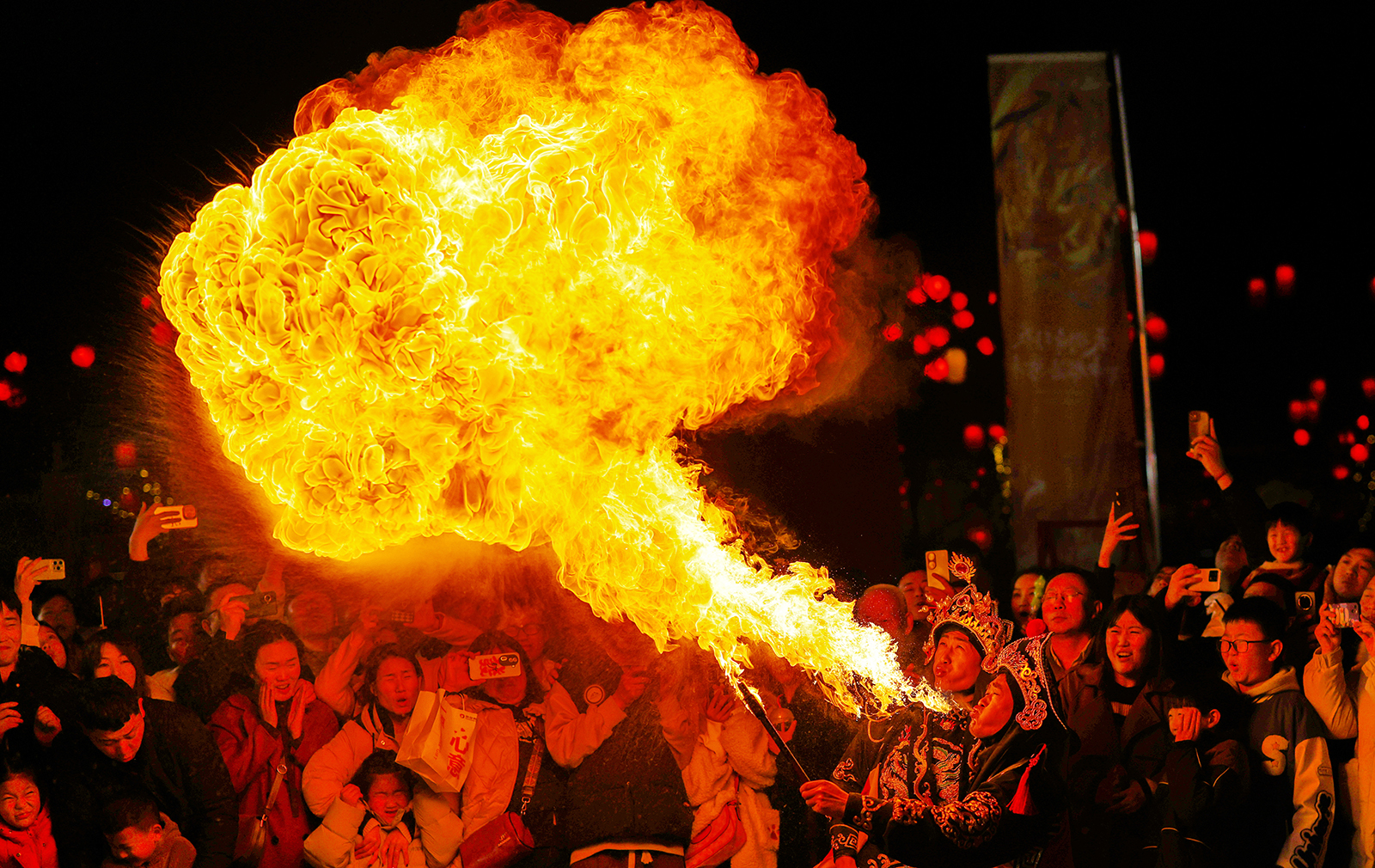 A fire-spitting stunt is staged during the Spring Festival holiday in Luoyang, Henan Province on February 17, 2024. /IC