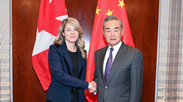 Chinese Foreign Minister Wang Yi (R), also a member of the Political Bureau of the Communist Party of China Central Committee, shakes hands with Canadian Foreign Minister Melanie Joly on the sidelines of the ongoing Munich Security Conference in Germany, February 17, 2024. /Chinese Foreign Ministry