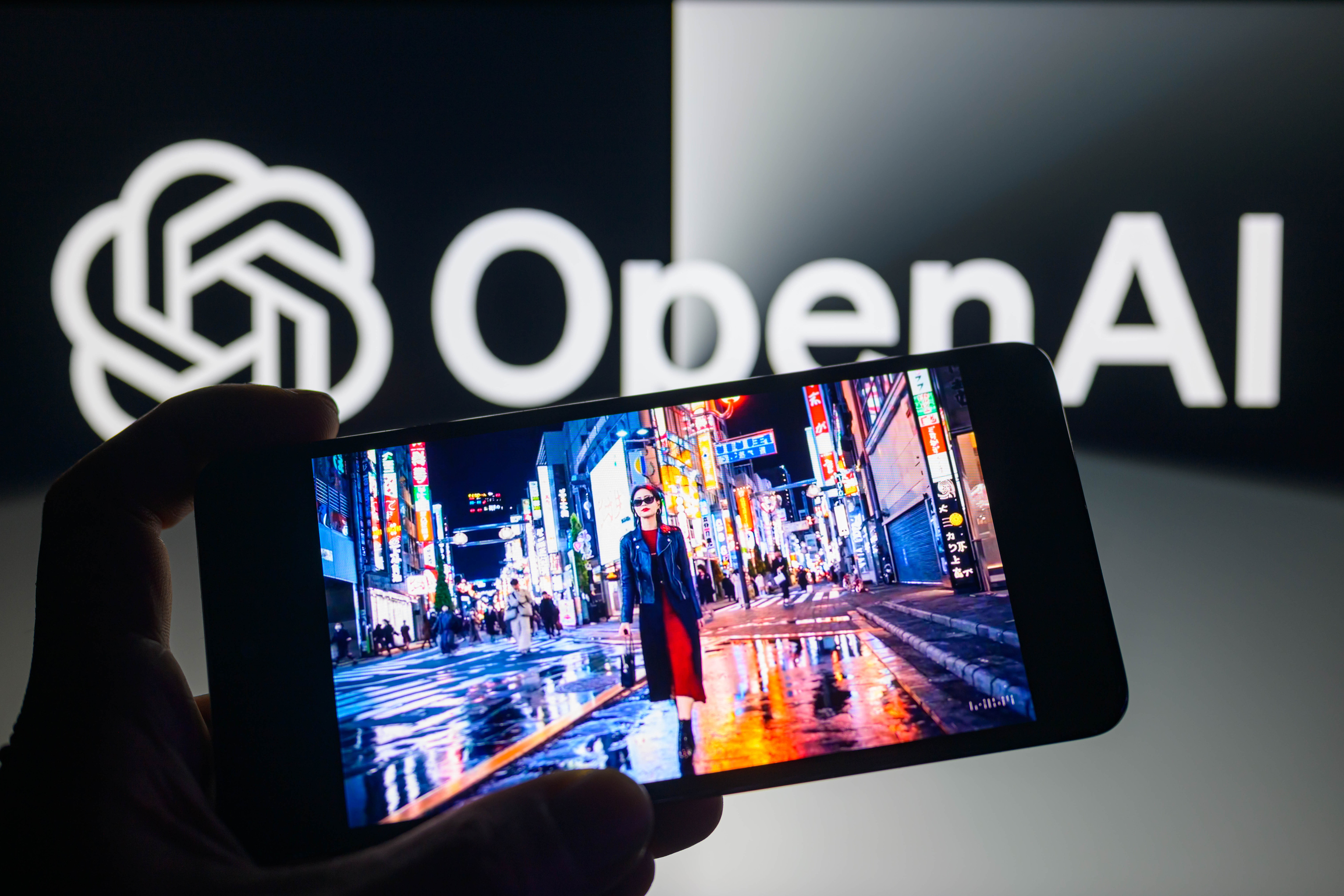 A scene from a video produced by Sora model is being displayed on a smartphone with the OpenAI logo visible in the background, Brussels, Belgium, February 16, 2024. /CFP