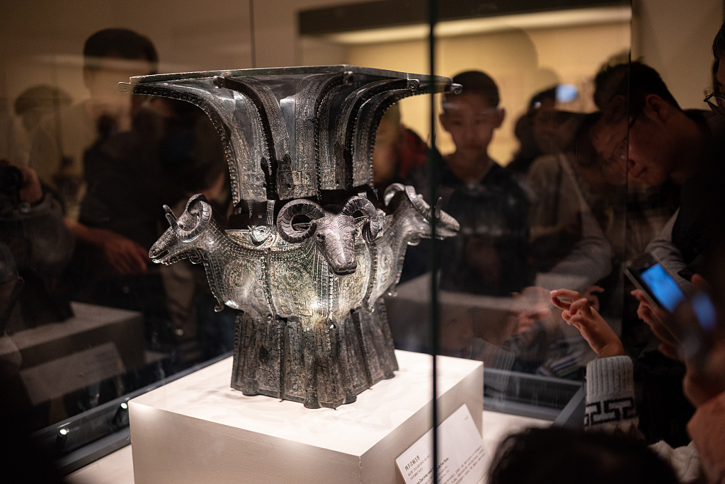 Visitors admire the square vessel (zun) with four rams at the National Museum of China in Beijing during the Spring Festival holiday on February 14, 2024. /CFP