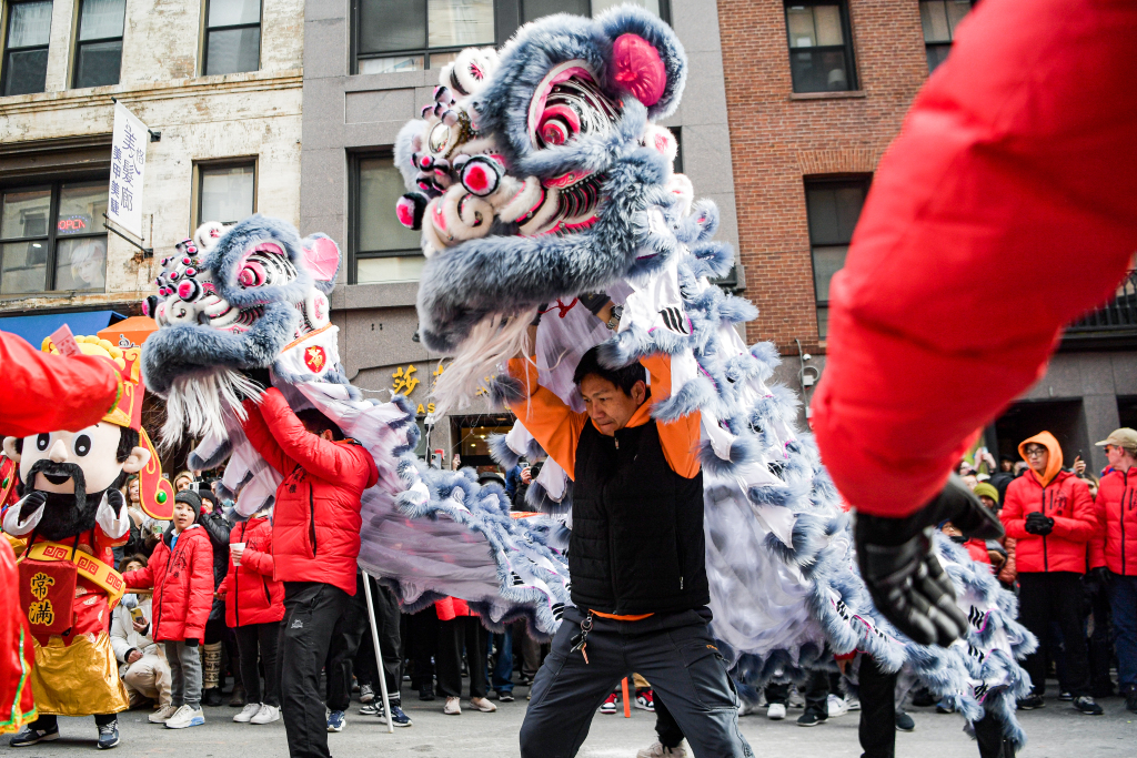 A lion dance performance is staged on a street in Boston, United States, February 18, 2024. /CFP