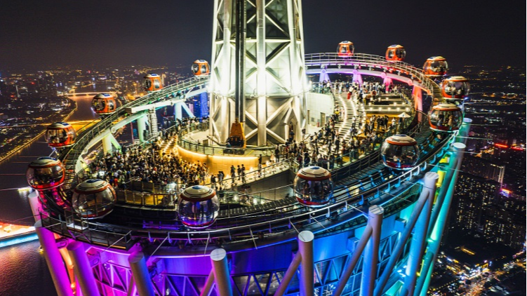 Tourists gather at the top of Canton Tower to get a bird's eye view of the city, in Guangzhou, south China's Guangdong Province, April 28, 2023. /CFP