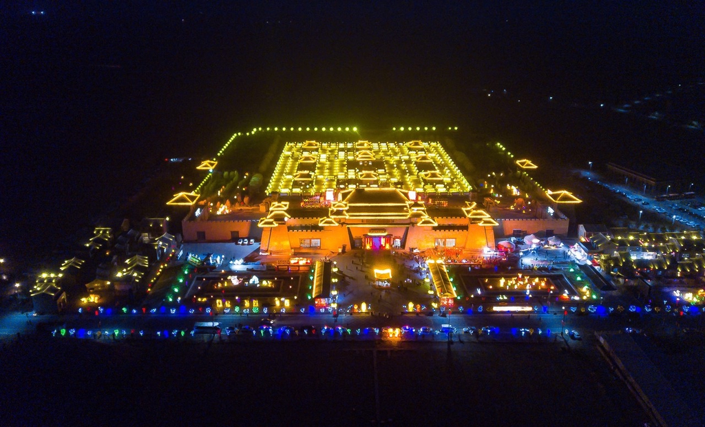 A bird's-eye view photo shows Wulan Ancient Town lit up at night in Zhangye, Gansu Province, February 19, 2024. /IC