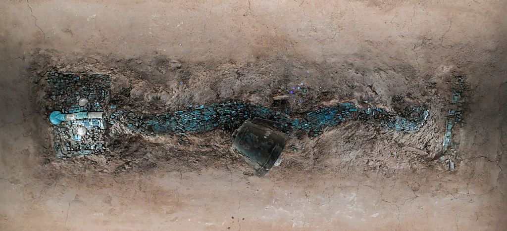 A file photo shows the turquoise dragon-shaped artifact unearthed from a piece of timber at the Erlitou site in Henan Province, China. /CFP