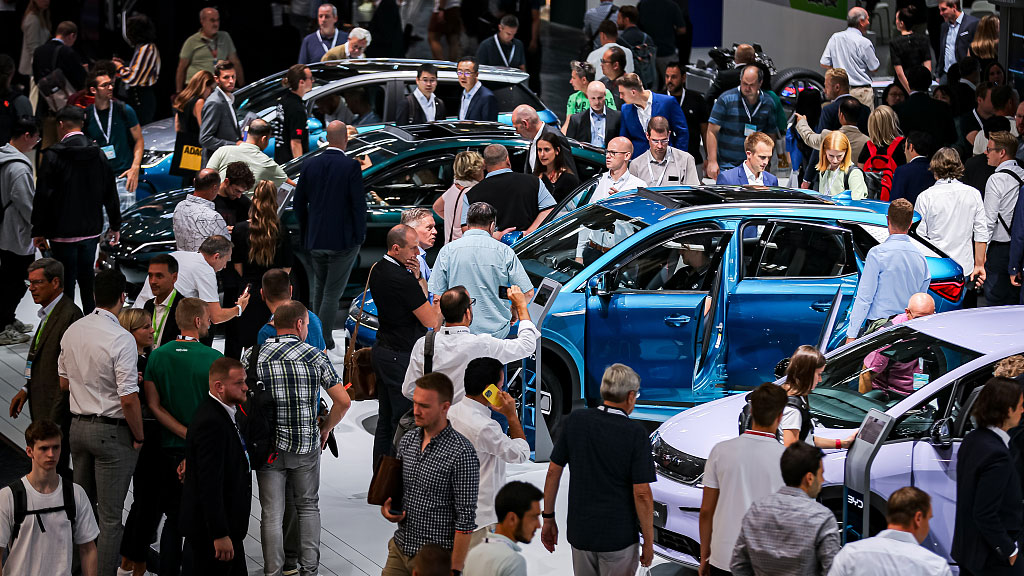 Visitors look at electric cars of Chinese car brand BYD at the IAA Mobility 2023 international motor show, Munich, Germany, September 6, 2023. /CFP