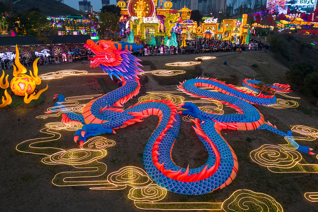 A dragon lantern measuring over 200 meters long is seen at the 30th International Dinosaur Lantern Show in Zigong, Sichuan Province on February 7, 2024. The lantern was made by bundling around 200,000 discarded water bottles together. /CFP