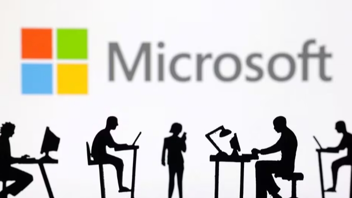 Figurines with computers and smartphones are seen in front of Microsoft Corporation logo in this illustration taken, February 19, 2024. /Reuters