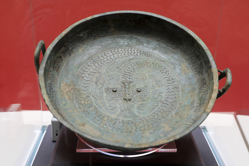 A photo taken at the Shanghai Museum on February 20, 2024 shows a bronze pan water basin with a dragon design, dating back to the Western Zhou Dynasty (1046-771 BC). /CFP