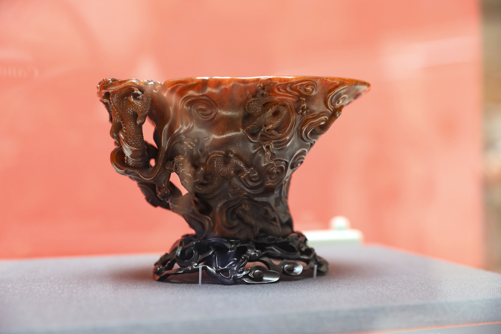 A photo taken at the Shanghai Museum on February 20, 2024 shows a rhinoceros horn cup with dragon carvings, dating back to the Ming Dynasty (1368-1644). /CFP