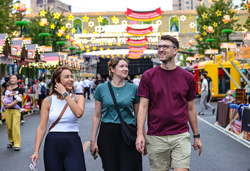 German tourists walk in the Sino-German international style street, Shenyang, Liaoning Province, July 30, 2023. /CFP