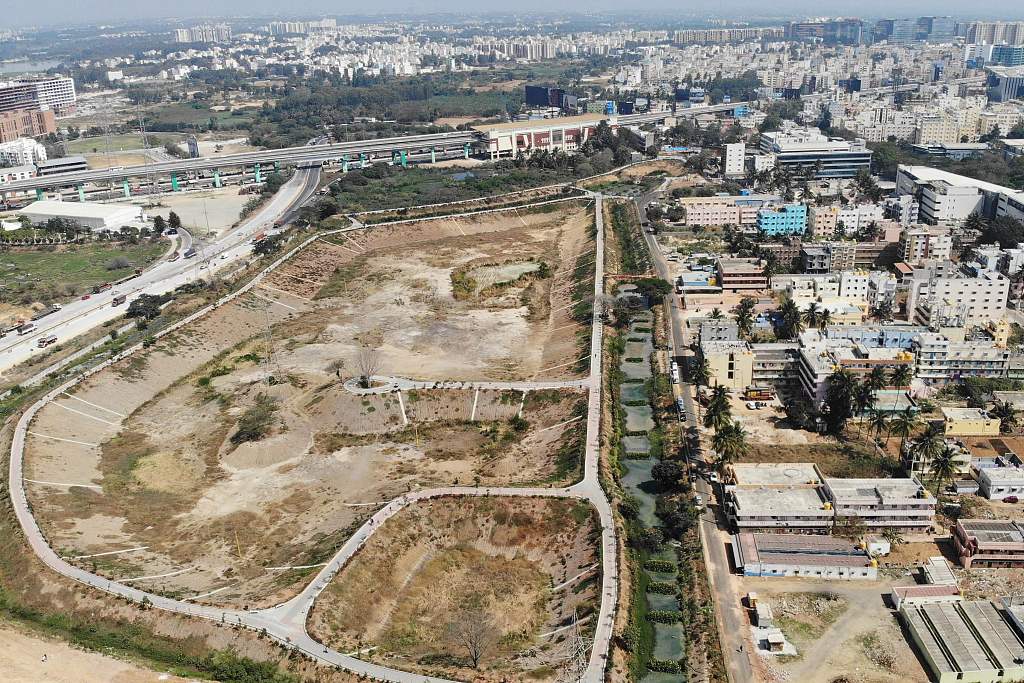 An aerial view of the arid Doddathogur lakebed next to buildings in Bengaluru, India, January 29, 2024. /CFP