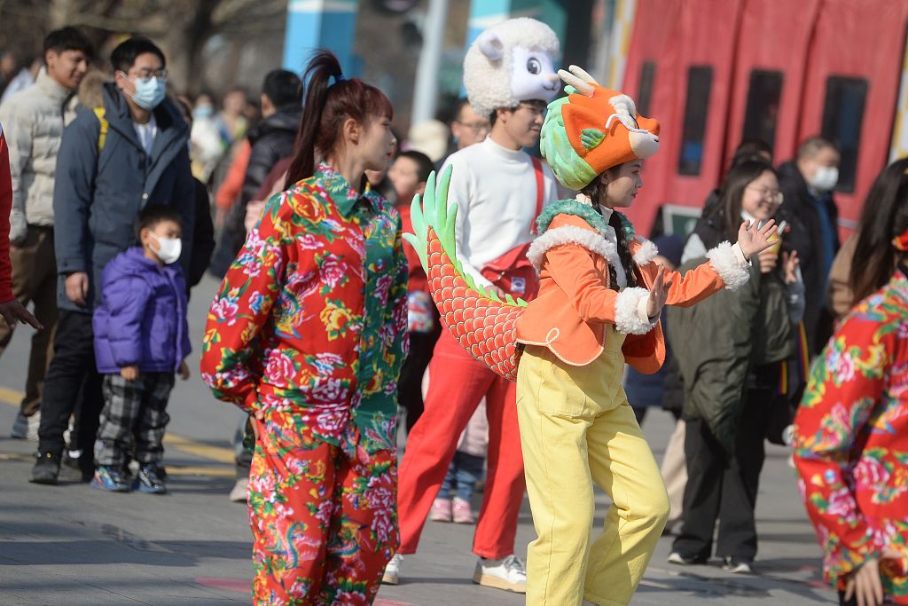 Visitors wearing costumes featuring Chinese elements attend activities highlighting 