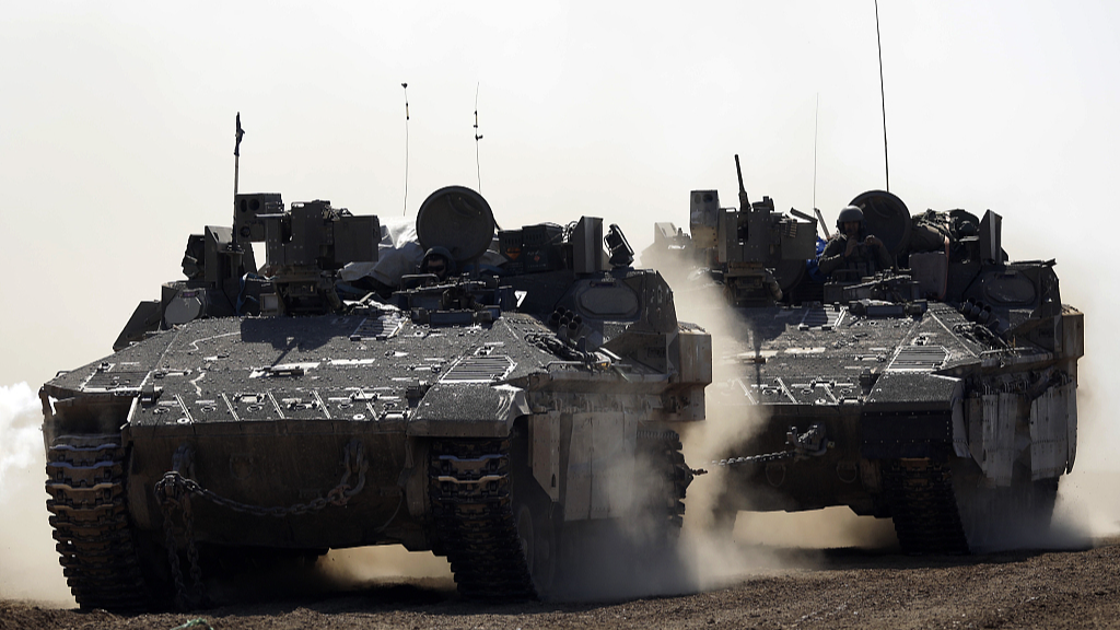 Israeli armored personnel carriers move near the border with the Gaza Strip, February 21, 2024. /CFP