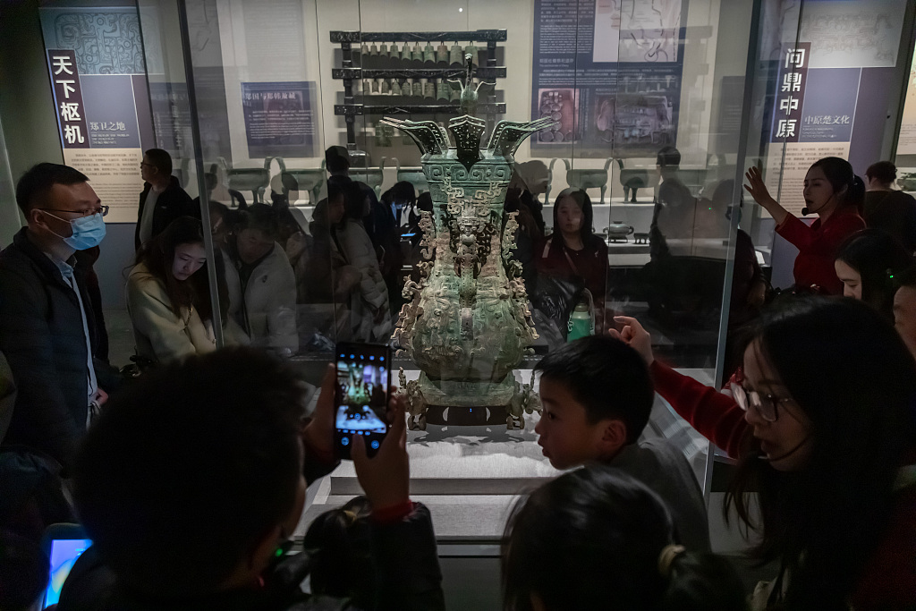 A photo taken on February 10, 2024 shows visitors appreciating the Lotus and Crane Square Pot on display at the Henan Museum in Zhengzhou, central China's Henan Province. /CFP
