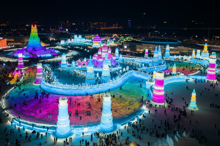 This aerial photo shows tourists visiting the Harbin Ice-Snow World in Harbin, northeast China's Heilongjiang Province, December 31, 2023. /Xinhua