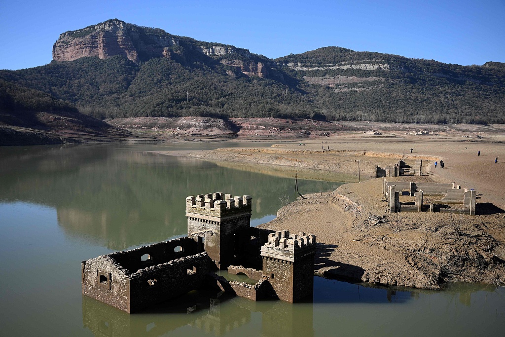 The partially submerged mill of Sant Roma de Sau at the low water-level reservoir of Sau in Vilanova de Sau in Catalonia, Spain, February 12, 2024. /AFP 