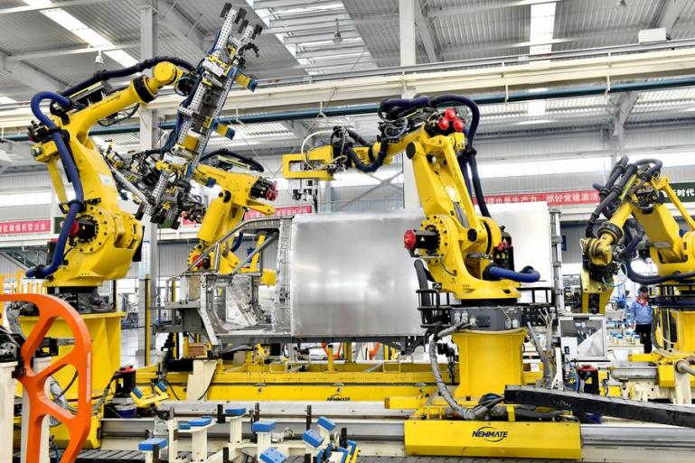 Robots work on an assembly line of a factory of a private enterprise in Zouping City, east China's Shandong Province, September 13, 2023. /Xinhua