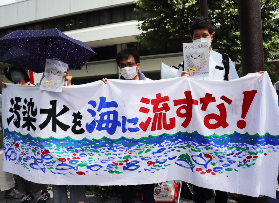 People gather to protest the Japanese government and Tokyo Electric Power Company's (TEPCO) decision on releasing nuclear-contaminated wastewater in front of the headquarters of TEPCO in Tokyo, Japan, August 24, 2023. /Xinhua