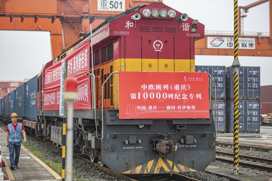 A cargo train marking the 10,000th trip made by China-Europe freight trains operated by the China-Europe Railway Express (Chongqing), waits for departure at Tuanjie Village Central Railway Station in Chongqing, southwest China, June 23, 2022. /Xinhua