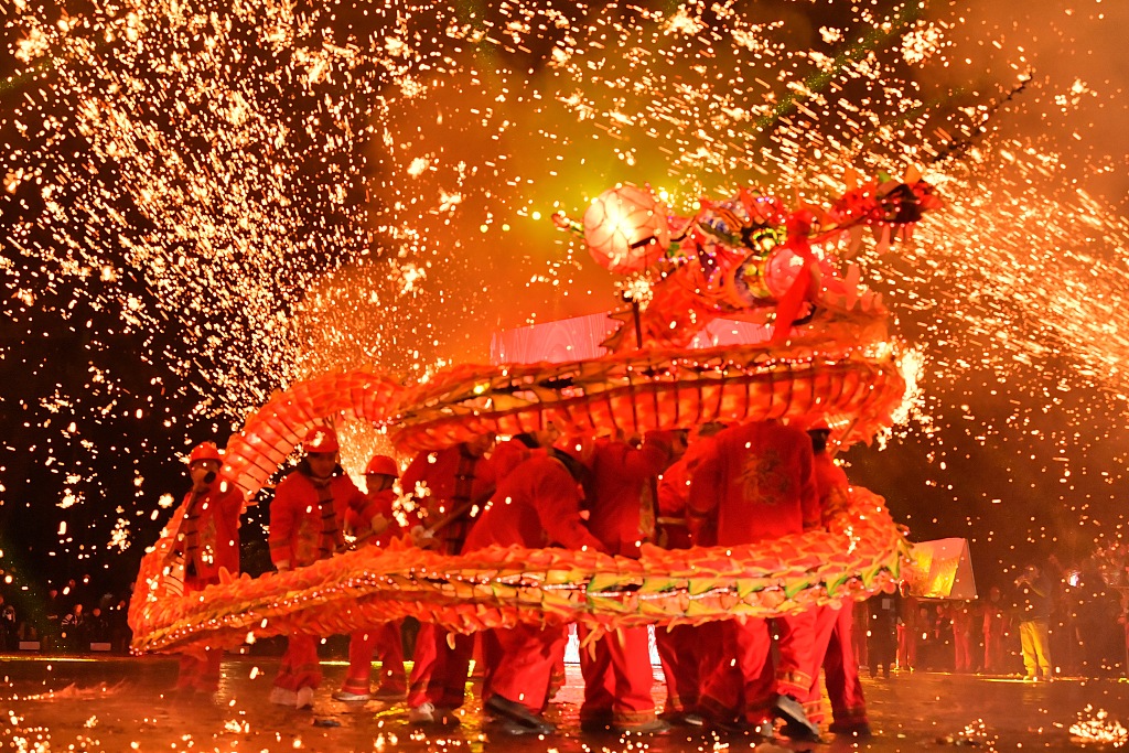 People perform Wulong Xuhua in Taijiang, southwest China's Guizhou Province, on February 23, 2024. /CFP