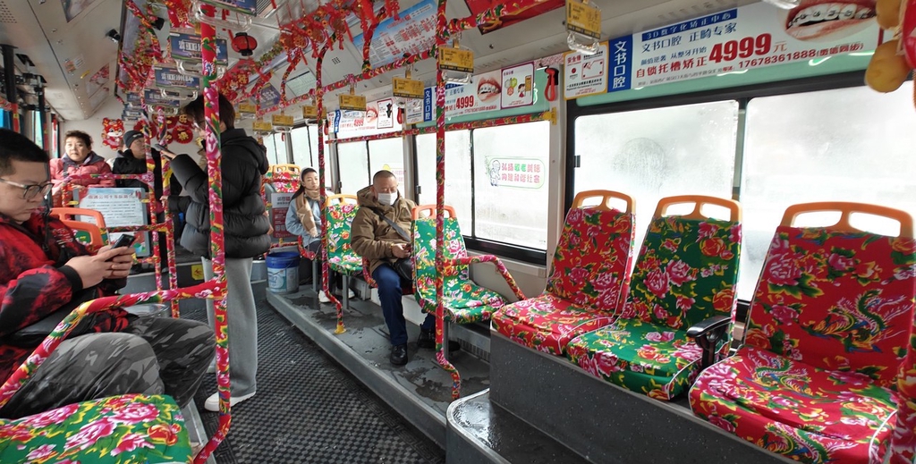 A photo shows the interior of a bus decorated with a popular flower pattern in Changchun, Jilin Province, February 20, 2024. /IC