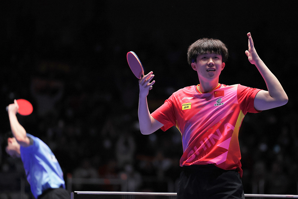Wang Chuqin (R) celebrates during the men's semifinal clash between China and South Korea at the ITTF World Team Table Tennis Championships Finals in Busan, South Korea, February 24, 2024. /CFP