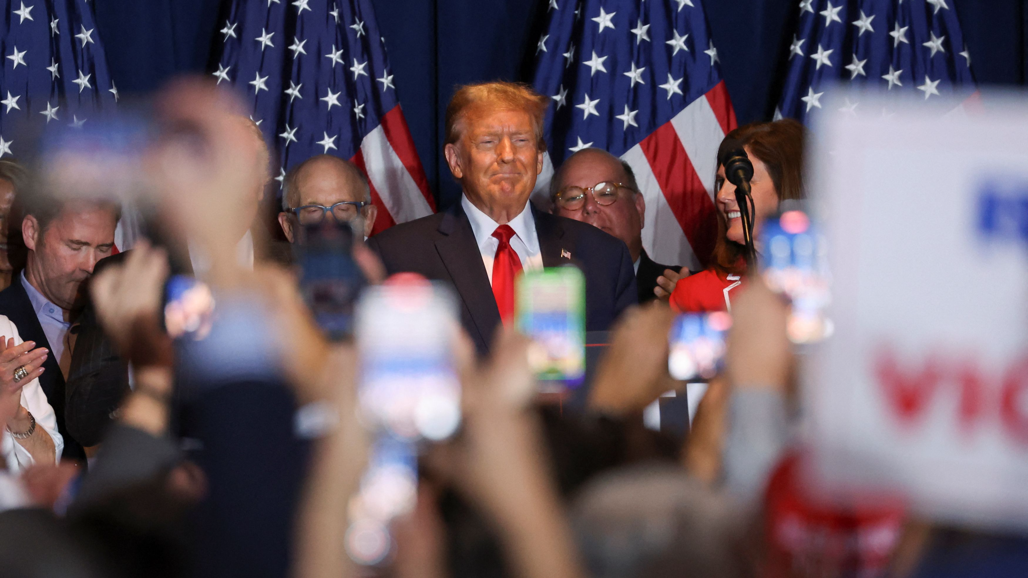 Republican presidential candidate and former U.S. President Donald Trump stands on stage as he hosts a South Carolina Republican presidential primary election night party in Columbia, South Carolina, U.S. February 24, 2024. /Reuters