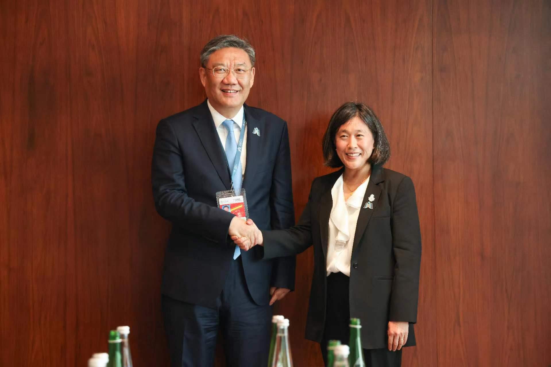 China's Minister of Commerce Wang Wentao (L) shakes hands with U.S. Trade Representative Katherine Tai in Abu Dhabi, United Arab Emirates, February 26, 2024. /China Media Group