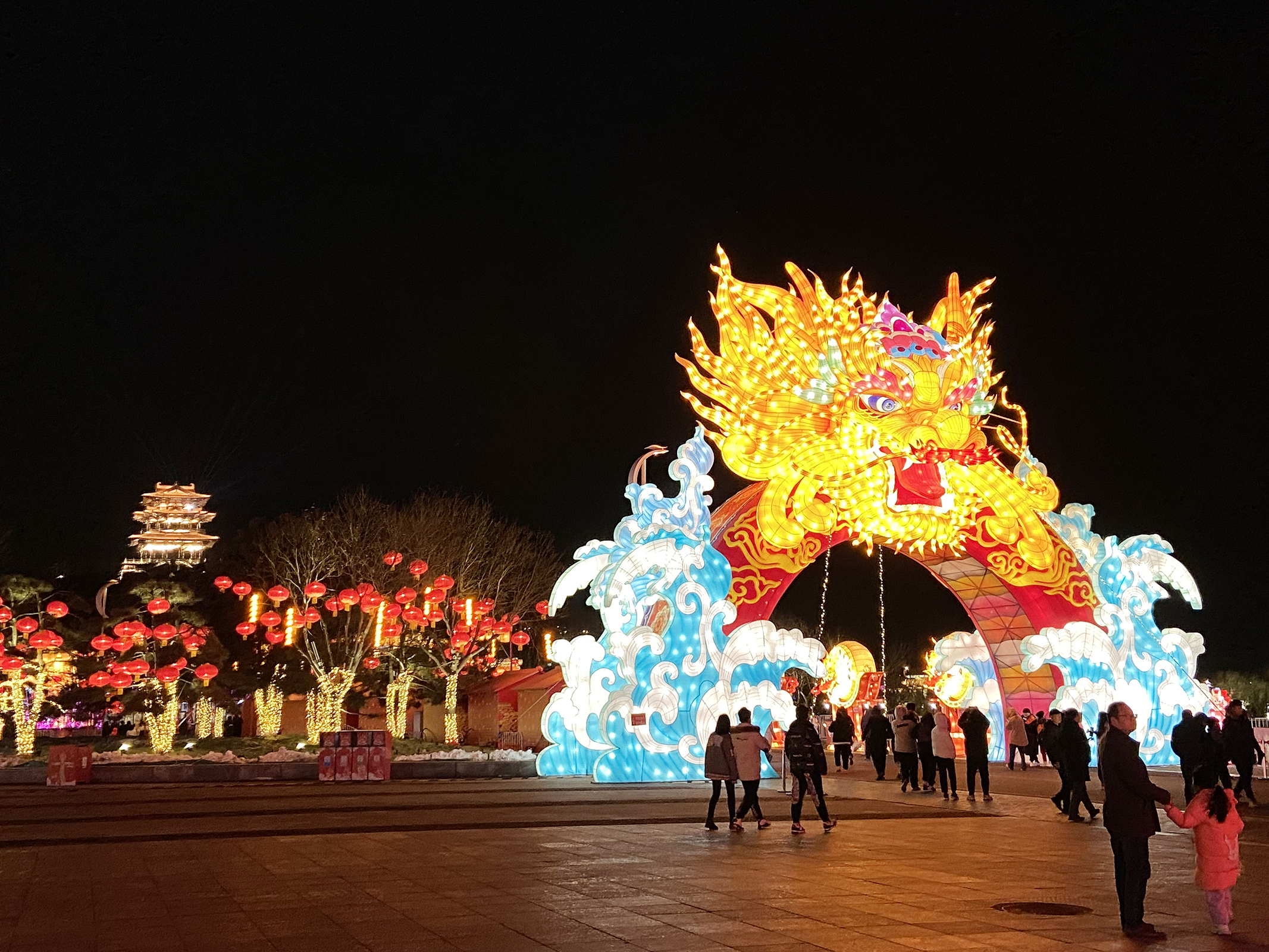 Visitors admire a dragon-themed set of lanterns at the South Lake Park in Tangshan, Hebei Province on February 23, 2024. /CGTN