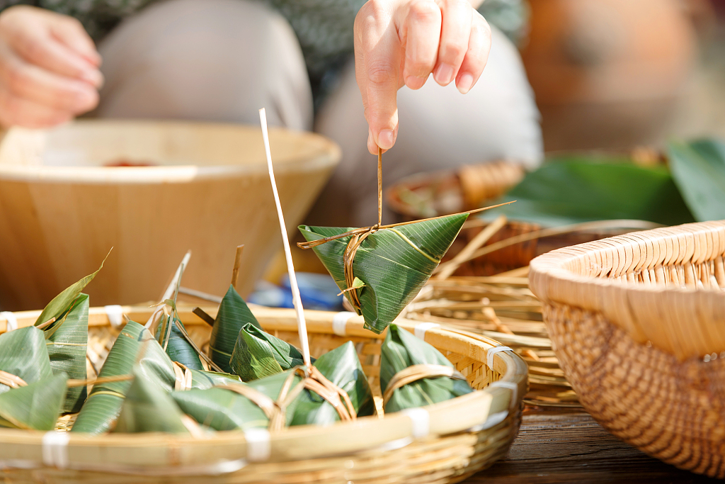 Zongzi are a traditional Chinese dish made of glutinous rice stuffed with different fillings and wrapped in bamboo leaves or reeds. /CFP