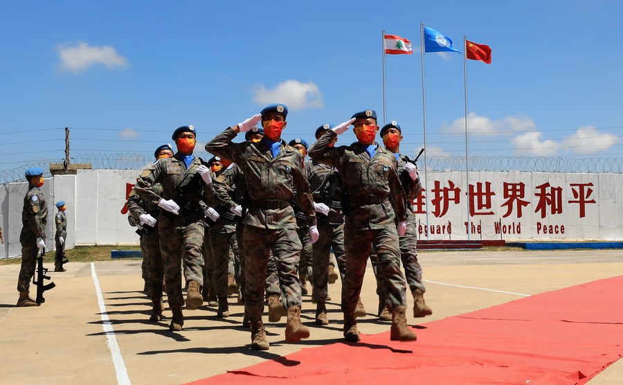 Chinese peacekeepers march at a medal parade ceremony in Hanniyah village, southern Lebanon, July 1, 2022. /Xinhua