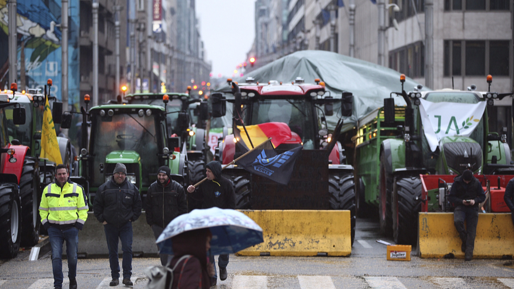 Tractors are parked behind a blockade in the European Quarter during a protest of farmers outside a meeting of EU agriculture ministers in Brussels, Belgium, February 26, 2024. /CFP