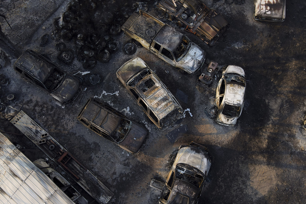 Charred vehicles sit at an auto body shop after the property was burned by the Smokehouse Creek Fire in Canadian, Texas, February 28, 2024. /CFP