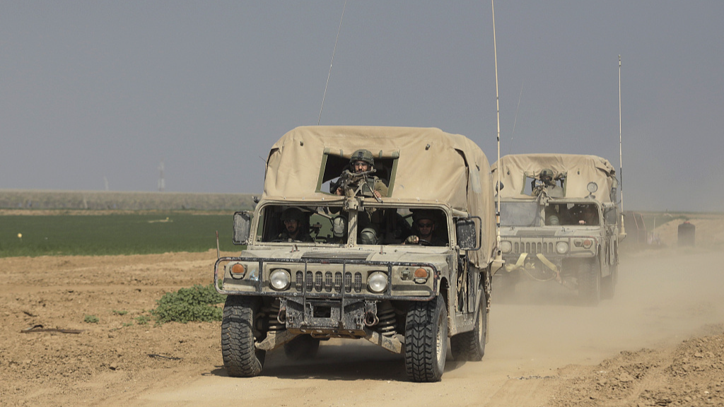 Israeli military vehicles move along the border with the Gaza Strip in southern Israel, February 28, 2024. /CFP