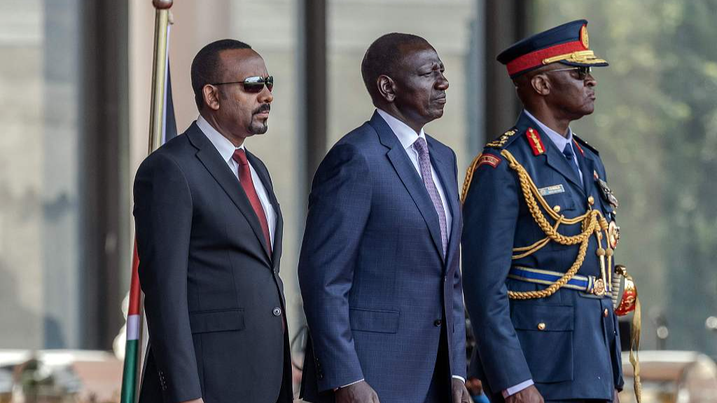Visiting Ethiopian Prime Minister Abiy Ahmed (L) and President William Ruto of Kenya (C) stand while inspecting a guard of honor by members of the Kenya Defence Forces during his official state visit to State House in Nairobi, February 28, 2024. /CFP