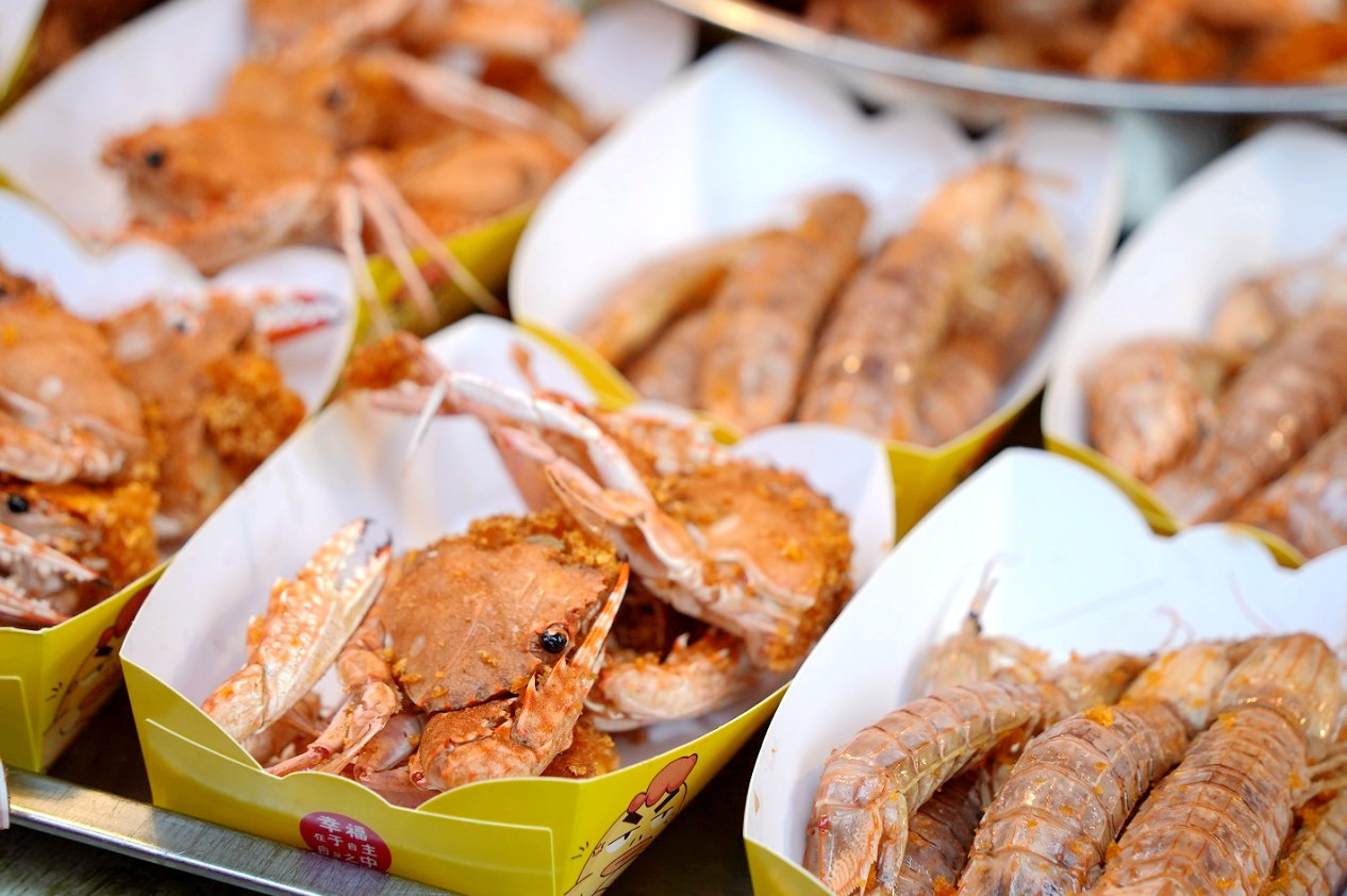 Fried crabs and shrimps are seen in Haikou, south China's Hainan Province. /Photo provided to CGTN