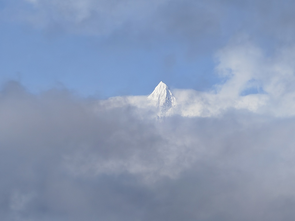A photo taken on February 29, 2024 shows the swirling clouds on Meili Snow Mountain's peak in Deqen Tibetan Autonomous Prefecture, southwest China's Yunnan Province. /CFP