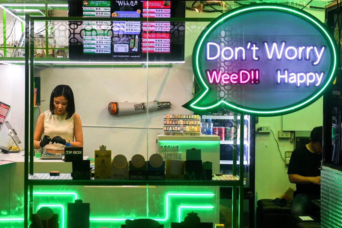 A woman works inside a cannabis shop at Khaosan Road in Bangkok, Thailand, March 29, 2023. /Reuters