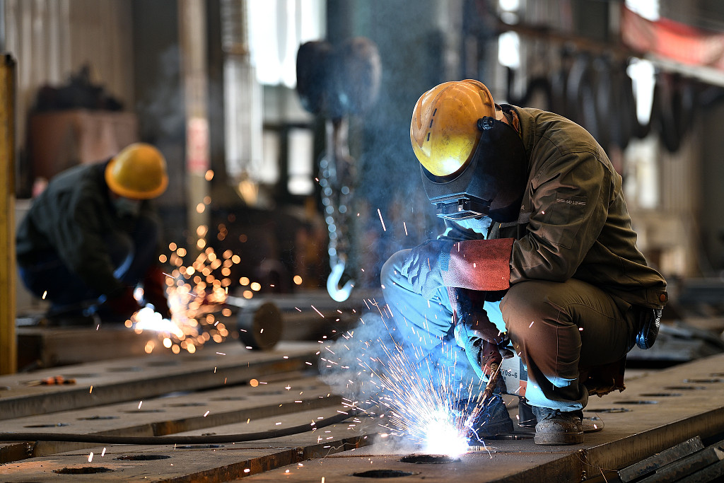 Workers welding in a workshop in Taiyuan, north China's Shanxi Province on February 29, 2024. /CFP