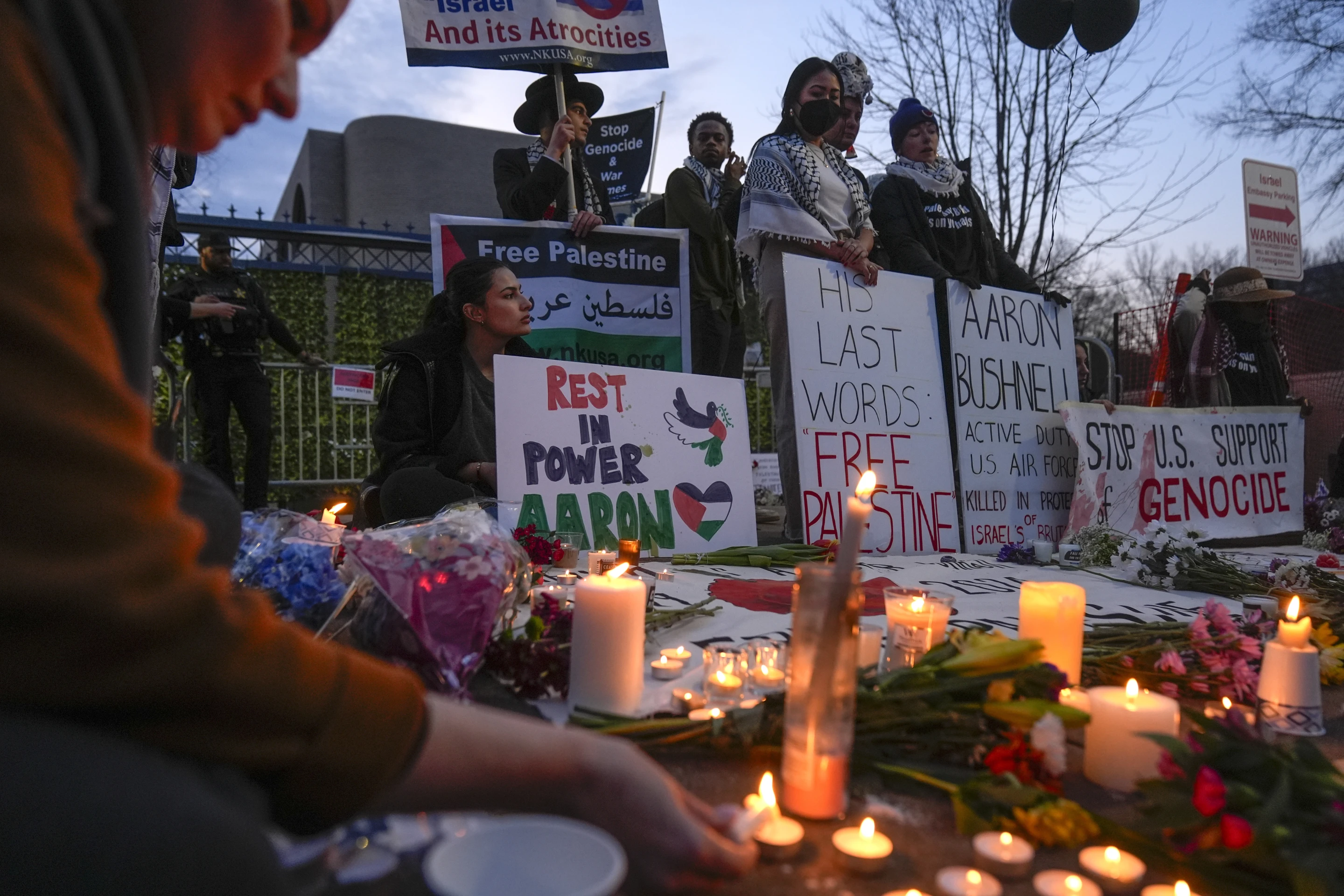 Demonstrators light candles during a vigil outside the Israeli Embassy in Washington D.C., U.S., February 26, 2024. An active-duty member of the U.S. Air Force died after he set himself ablaze outside the Israeli Embassy, while declaring that he 