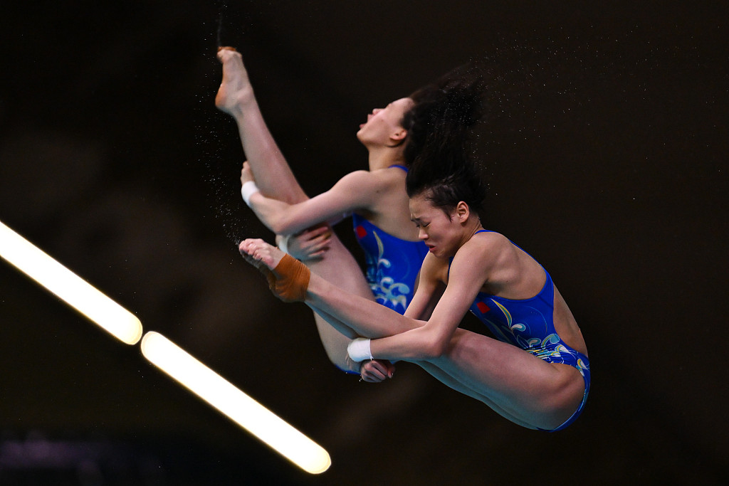 Quan Hongchan and Chen Yuxi of China compete in the women's 10-meter synchronized platform final at the World Aquatics Fiving World Cup in Montreal, Canada, March 2, 2024. /CFP