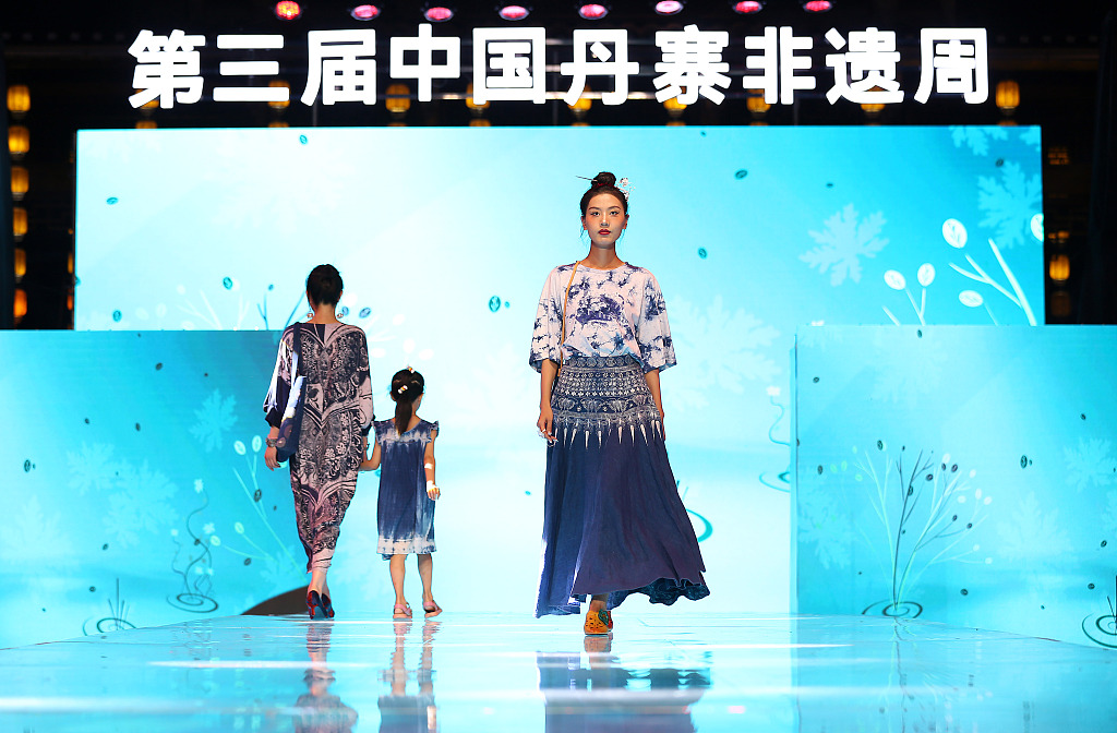 Models present clothing featuring the elements of Miao batik during a fashion show in Danzhai County, southwest China's Guizhou Province. /CFP