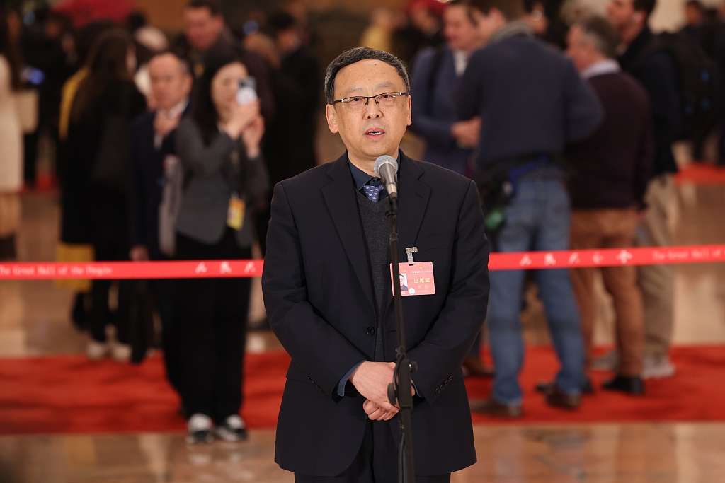 Hang Kan, a deputy to China's 14th National People's Congress (NPC), speaks at the Deputies' Corridor, Beijing, China, March 5, 2024. /CFP