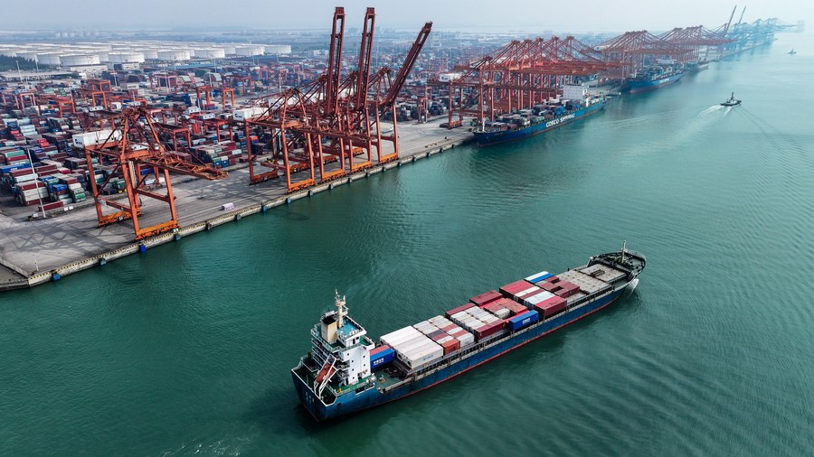 An aerial view of a container vessel setting off from the Qinzhou Port in Qinzhou City, south China's Guangxi Zhuang Autonomous Region, November 24, 2023. /Xinhua