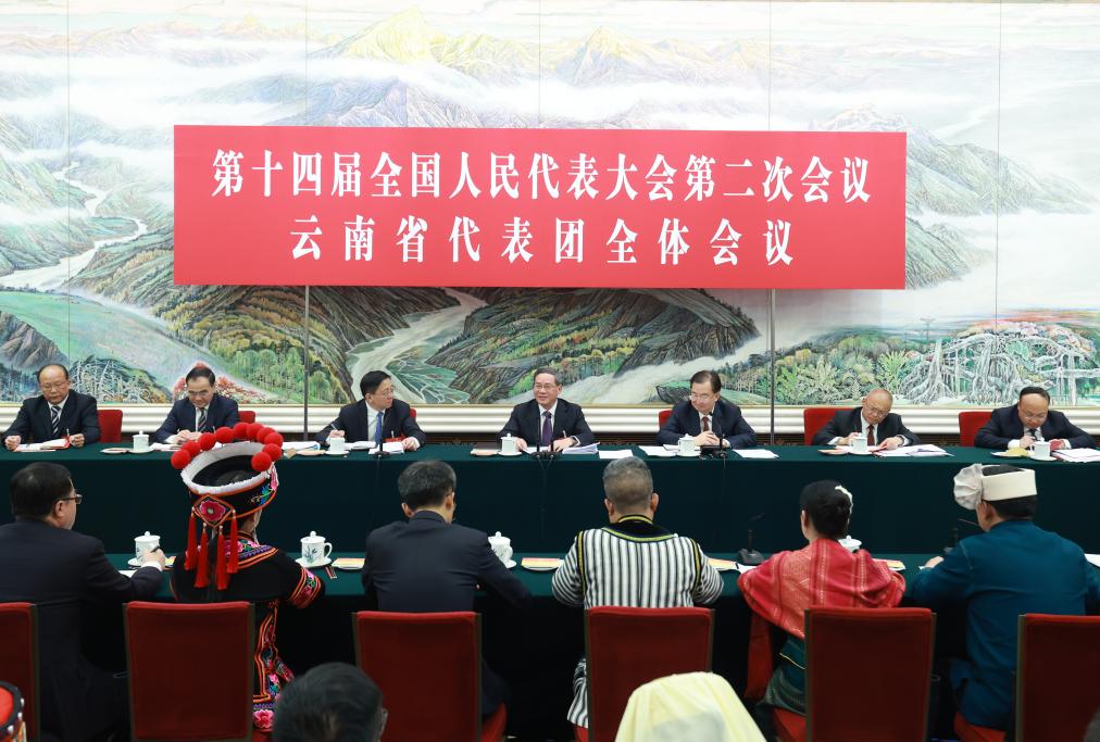 Li Qiang, a member of the Standing Committee of the Political Bureau of the Communist Party of China Central Committee and premier of the State Council, joins his fellow deputies from the delegation of Yunnan Province to deliberate on the government work report at the second session of the 14th National People's Congress (NPC) in Beijing, China, March 5, 2024. /Xinhua