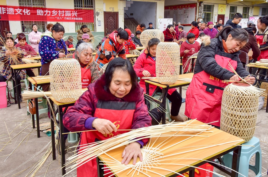 Women practice their bamboo weaving skills in Nanchong, Sichuan Province, March 5, 2024. /IC