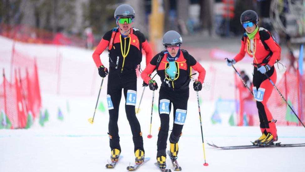 Cidan Yuzhen (C) and Buluer (L) during the mixed relay event at the Asian Ski Mountaineering Championships in Jilin City, northeast China's Jilin Province, March 6, 2024. /CFP