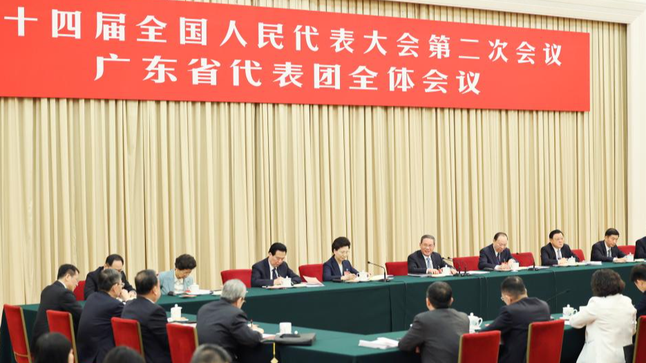 Li Qiang, a member of the Standing Committee of the Political Bureau of the Communist Party of China Central Committee and premier of the State Council, joins a deliberation with deputies from the delegation of Guangdong Province at the second session of the 14th National People's Congress in Beijing, capital of China, March 6, 2024. /Xinhua