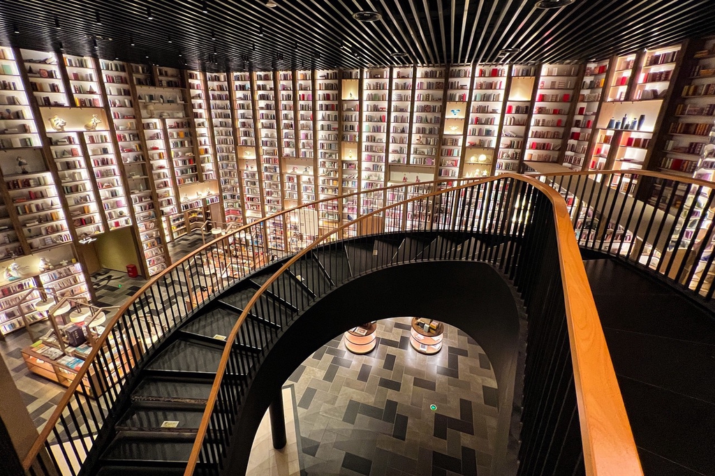 A curved staircase forms the centerpiece of the Village Book Store in Zhengzhou, Henan Province, March 6, 2024. /IC