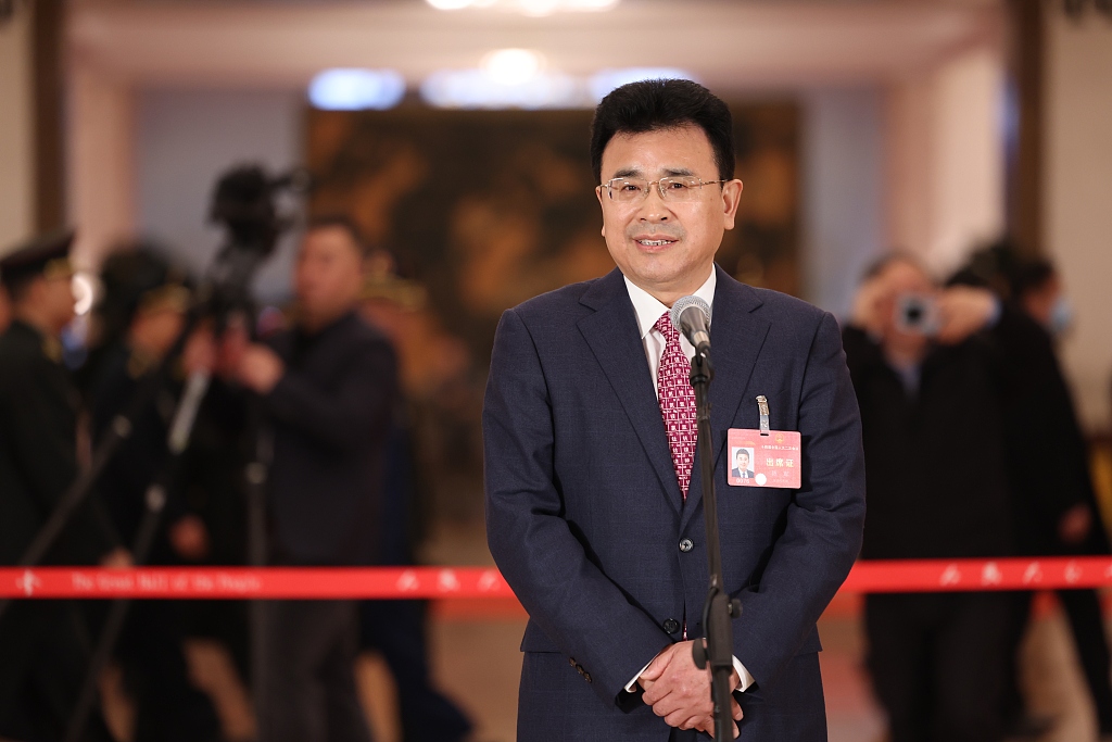 Chen Jun, a deputy to China's 14th National People's Congress (NPC), speaks at Deputies' Corridor in the Great Hall of the People in Beijing, March 8, 2024. /CFP